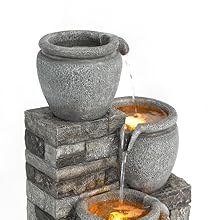 zoomed image of the pots overflowing with water and LED ligths on