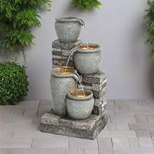 gray stone fountain in a courtyard 